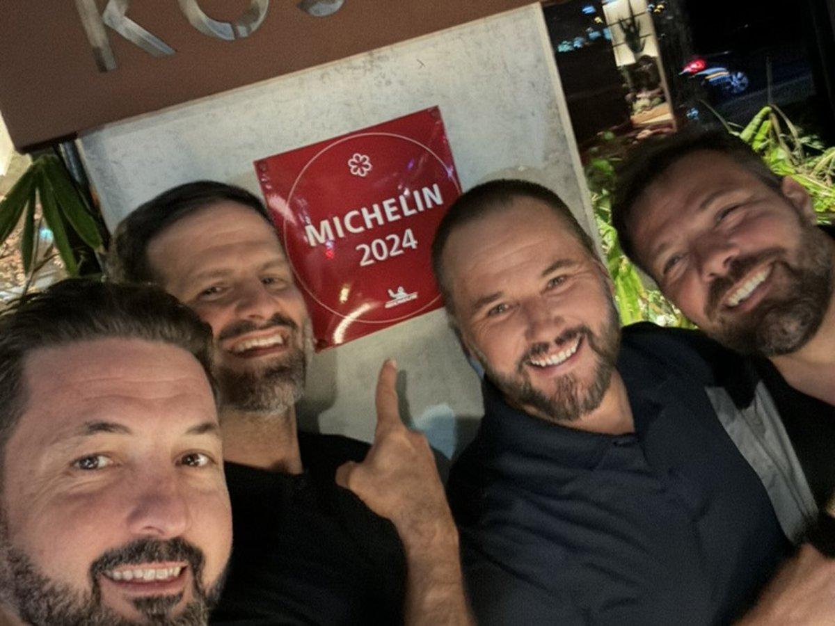 The Michelin Men at a dinner table